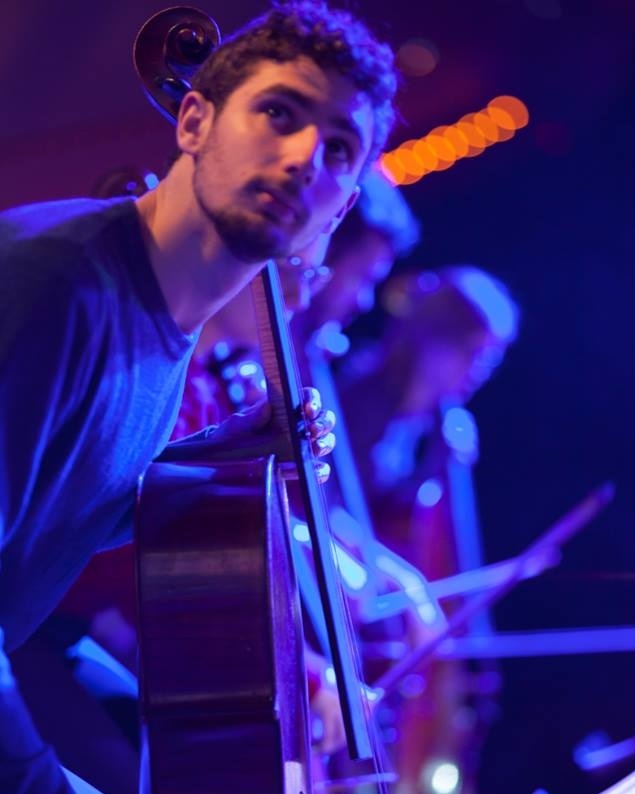 Adrián playing cello